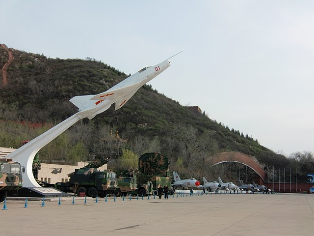 An overview of the outside display of the China Aviation Museum, in the back the tunnel with aircraft on display.
